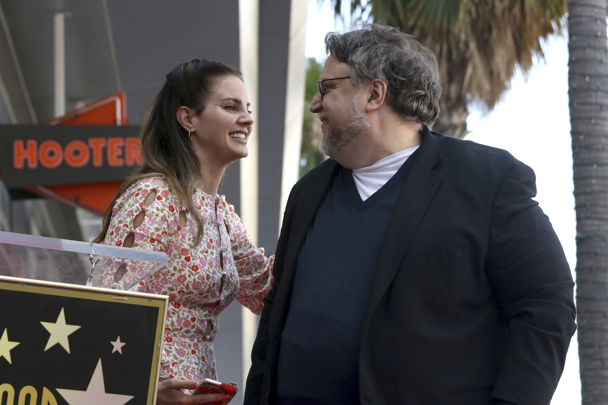 Lana Del Rey, left, and Guillermo del Toro smile at each other during a ceremony honoring the director with a star at the Hollywood Walk of Fame on Aug. 6, 2019 in Los Angeles. del Ray will be covering the 1966 song 