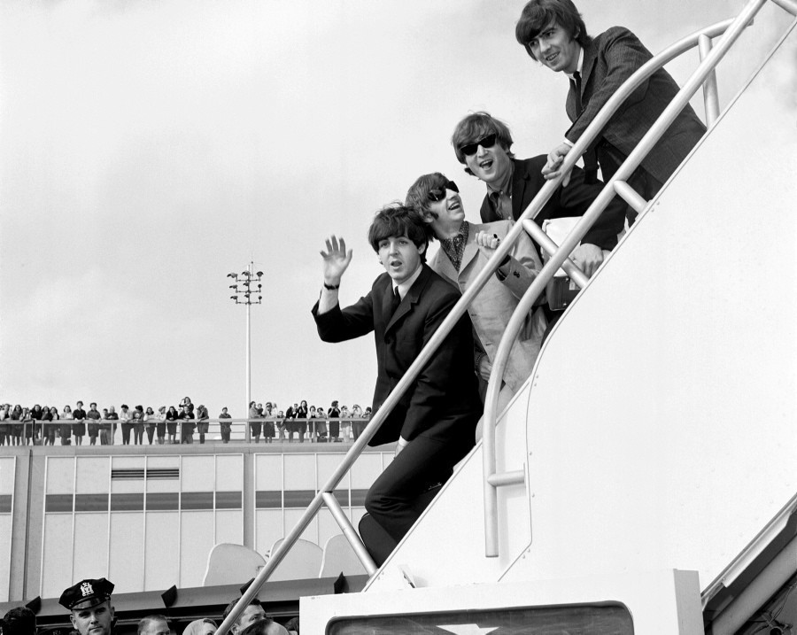 As The Beatles made their second American tour of the year, fans lined the rooftop at Kennedy International Airport to get a glimpse of the group before they hopped on their flight back to England on Sept. 21, 1964.