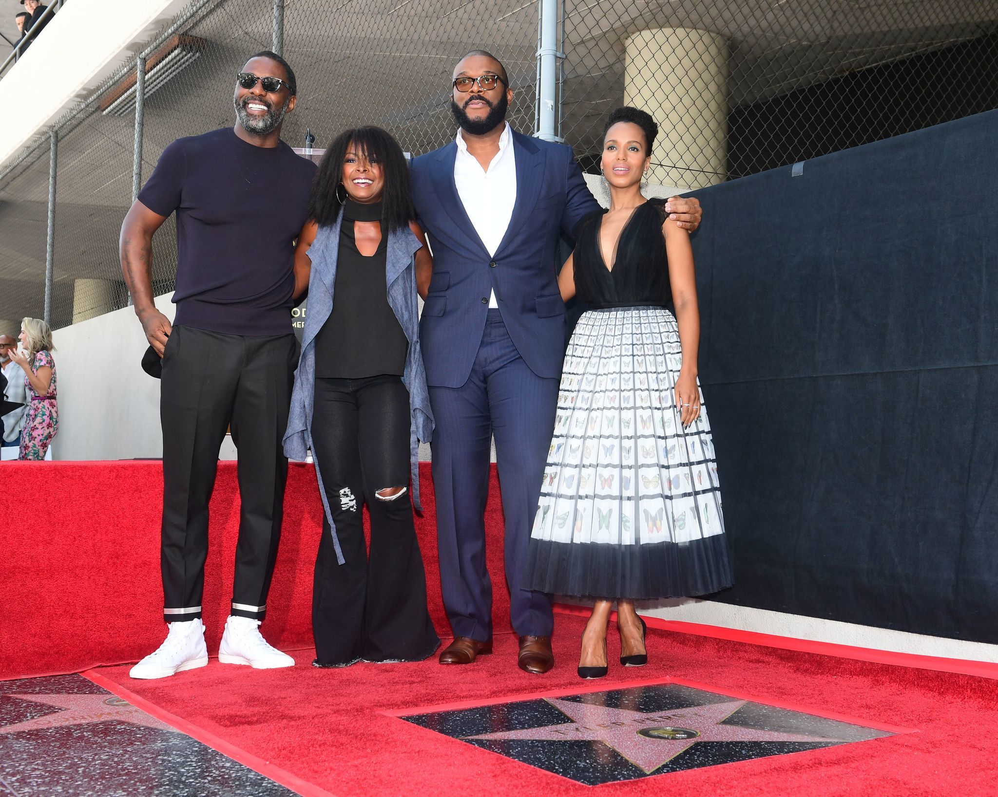Tyler Perry (2R) was all smiles receiving his star on the Hollywood Walk of Fame on Oct. 1, 2019. The director, actor and producer, who is famous for his stage plays centered around his comedic 