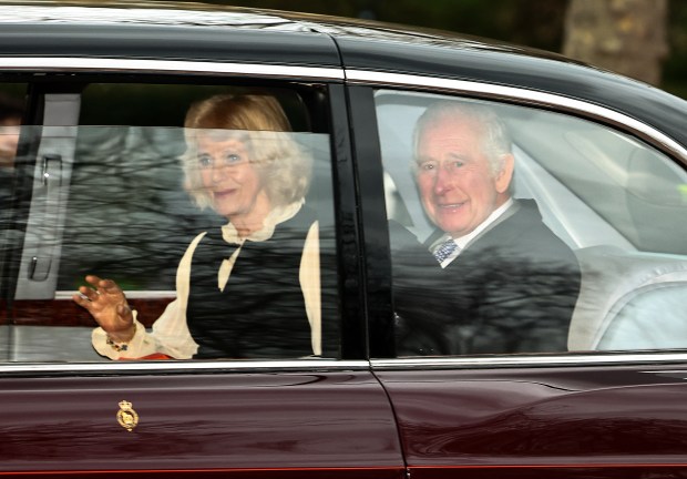 Britain's King Charles III and Britain's Queen Camilla wave as they leave by car from Clarence House in London on February 6, 2024. King Charles III's estranged son Prince Harry reportedly arrived in London on Tuesday after his father's diagnosis of cancer, which doctors "caught early". (Photo by HENRY NICHOLLS / AFP) (Photo by HENRY NICHOLLS/AFP via Getty Images) ** OUTS - ELSENT, FPG, CM - OUTS * NM, PH, VA if sourced by CT, LA or MoD **