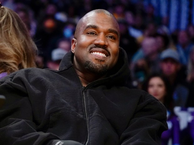 FILE - Kanye West, known as Ye, watches the first half of an NBA basketball game between the Washington Wizards and the Los Angeles Lakers, March 11, 2022, in Los Angeles. (AP Photo/Ashley Landis, File)