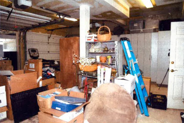 This image, contained in the report from special counsel Robert Hur, shows the cluttered garage of President Joe Biden in Wilmington, Del., during a search by the FBI on Dec. 21, 2022. (Justice Department via AP)
