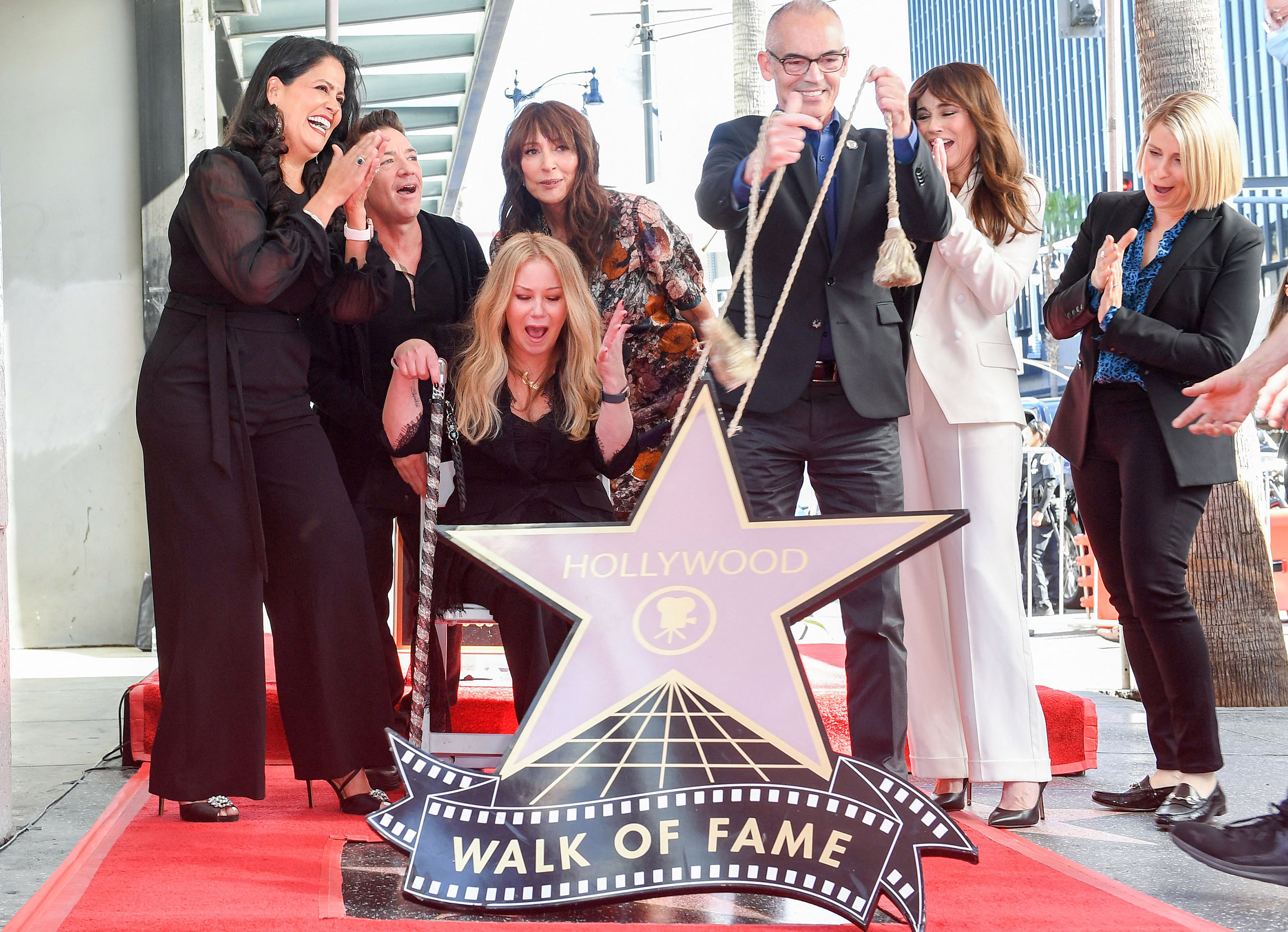 (L-R) Chair of the Hollywood Chamber of Commerce Lupita Sanchez Cornejo, actor David Faustino, actress Christina Applegate, actress Katey Sagal, Los Angeles City Council member Mitch O'Farrell, actress Linda Cardellini and comedian Liz Feldman pose for photos with Applegate's newly unveiled Hollywood Walk of Fame star in Hollywood, Calif. on Nov. 14, 2022.