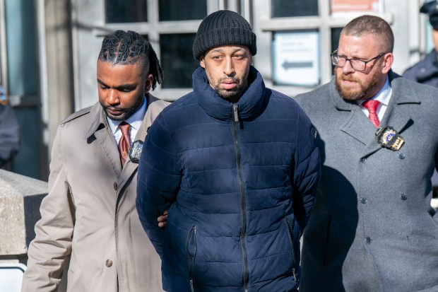 Luis Peroz, is pictured in custody outside the NYPD 9th Precinct station house in Manhattan on Saturday, February 4, 2023. (Theodore Parisienne for New York Daily News)