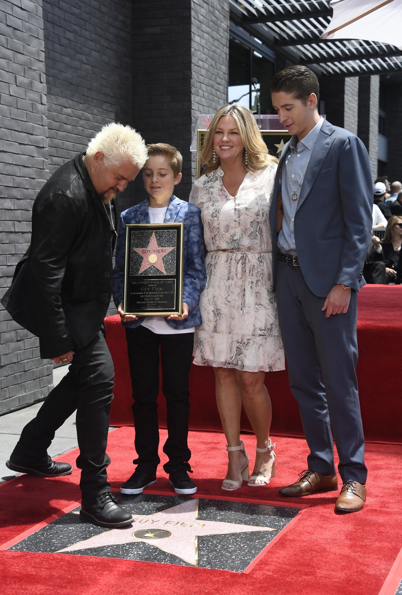 (L-R) Chef Guy Fieri with his family Ryder Fieri, Lori Fieri and Hunter Fieri attend the Hollywood Walk of Fame ceremony honoring Guy Fieri in Hollywood, California on May 22, 2019.