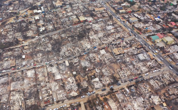 TOPSHOT - Aerial view of burned homes after a forest fire in Quilpue, Viña del Mar, Chile, taken on February 4, 2024. Chileans Sunday feared a rise in the death toll from wildfires blazing across the South American country that have already killed at least 51 people, leaving bodies in the street and homes gutted. (Photo by RODRIGO ARANGUA / AFP) (Photo by RODRIGO ARANGUA/AFP via Getty Images)
