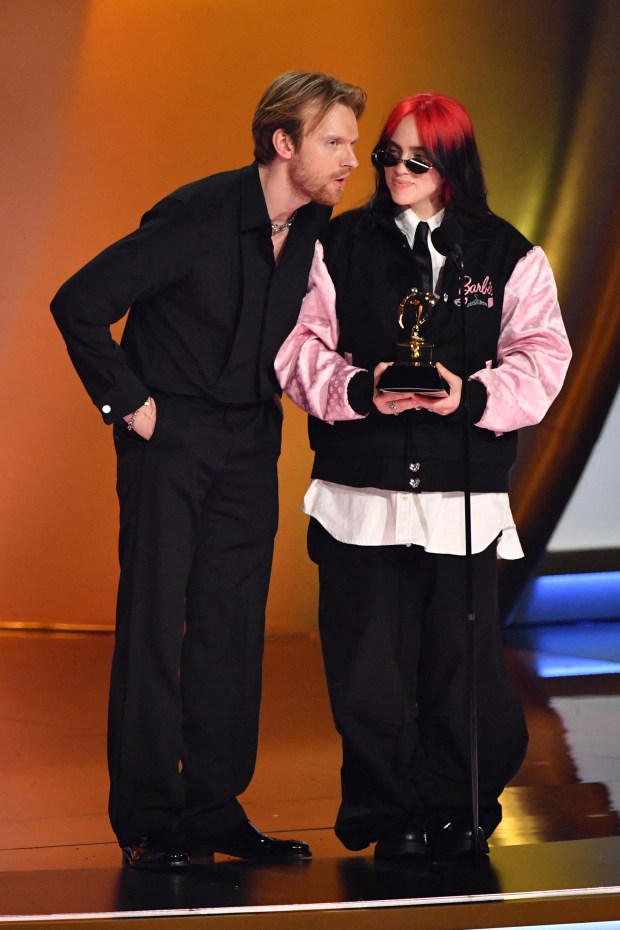 US singer-songwriter Billie Eilish (R) and US singer-songwriter Finneas O'Connell accept the Song Of The Year award for "What Was I Made For?" on stage during the 66th Annual Grammy Awards at the Crypto.com Arena in Los Angeles on February 4, 2024. (Photo by Valerie Macon / AFP) (Photo by VALERIE MACON/AFP via Getty Images)