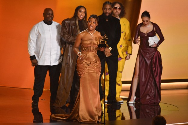 US singer-songwriter Victoria Monet (C) accepts the Best New Artist award on stage during the 66th Annual Grammy Awards at the Crypto.com Arena in Los Angeles on February 4, 2024. (Photo by Valerie Macon / AFP) (Photo by VALERIE MACON/AFP via Getty Images)