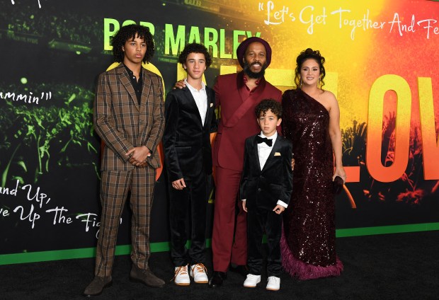 Jamaican musician Ziggy Marley (C), his wife Orly Marley (R) and family arrive for the premiere of "Bob Marley: One Love" at the Regency Village Theater in Los Angeles, California on February 6, 2024. (Photo by VALERIE MACON / AFP) (Photo by VALERIE MACON/AFP via Getty Images)