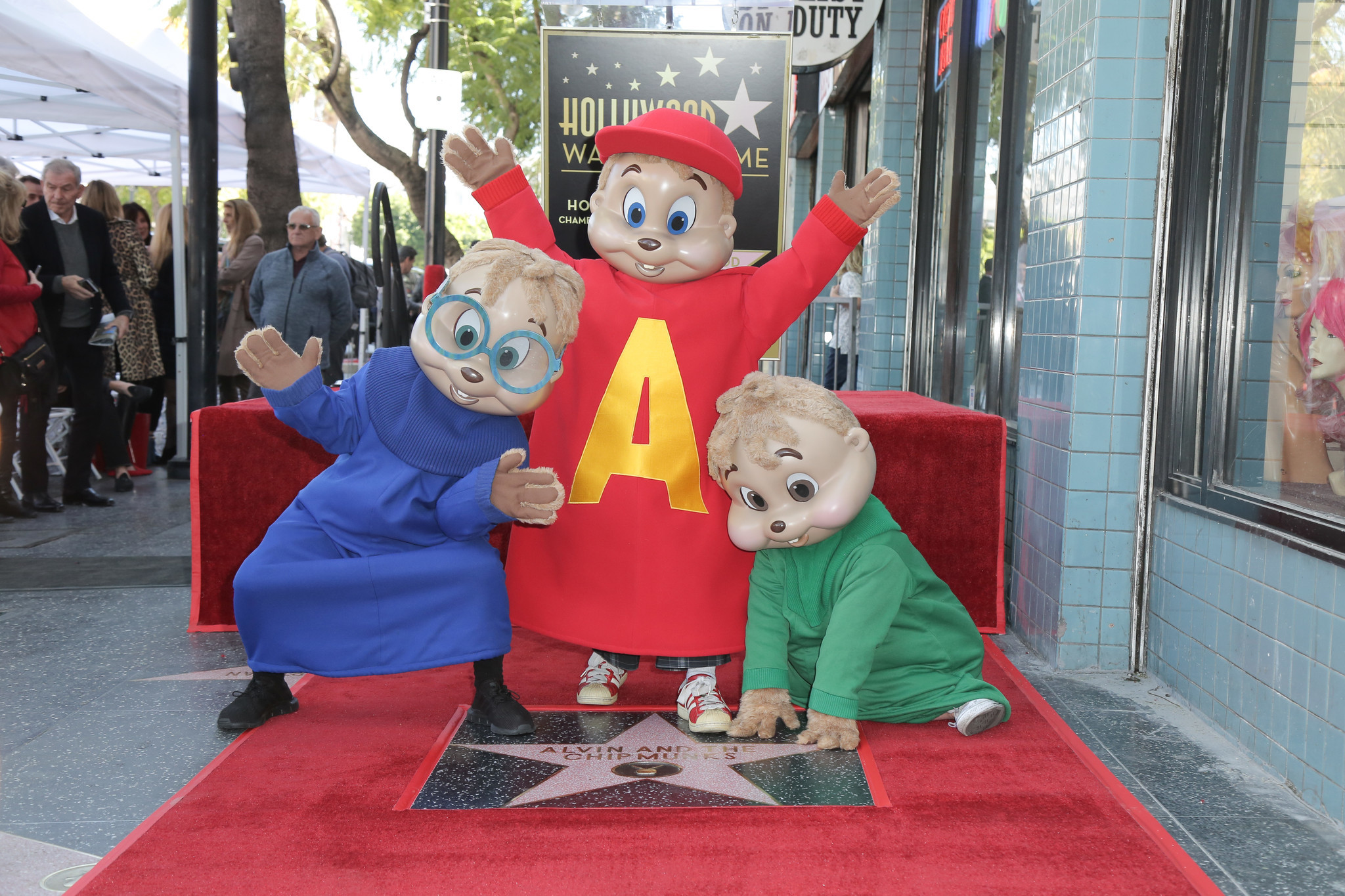From left to right, Simon, Alvin and Theodore Seville pose next to their new star on the Hollywood Walk of Fame on Mar. 14, 2019. The unveiling of the star is part of the furry Grammy-winning singing group's 60th anniversary.