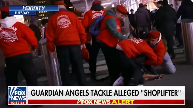 Guardian Angels are seen during a live broadcast on "Hannity" attack a man, who Curtis Sliwa claimed was a migrant who just shoplifted. Police, however, say this wasn't true the the man was not a migrant and had not shoplifted. (Fox News)