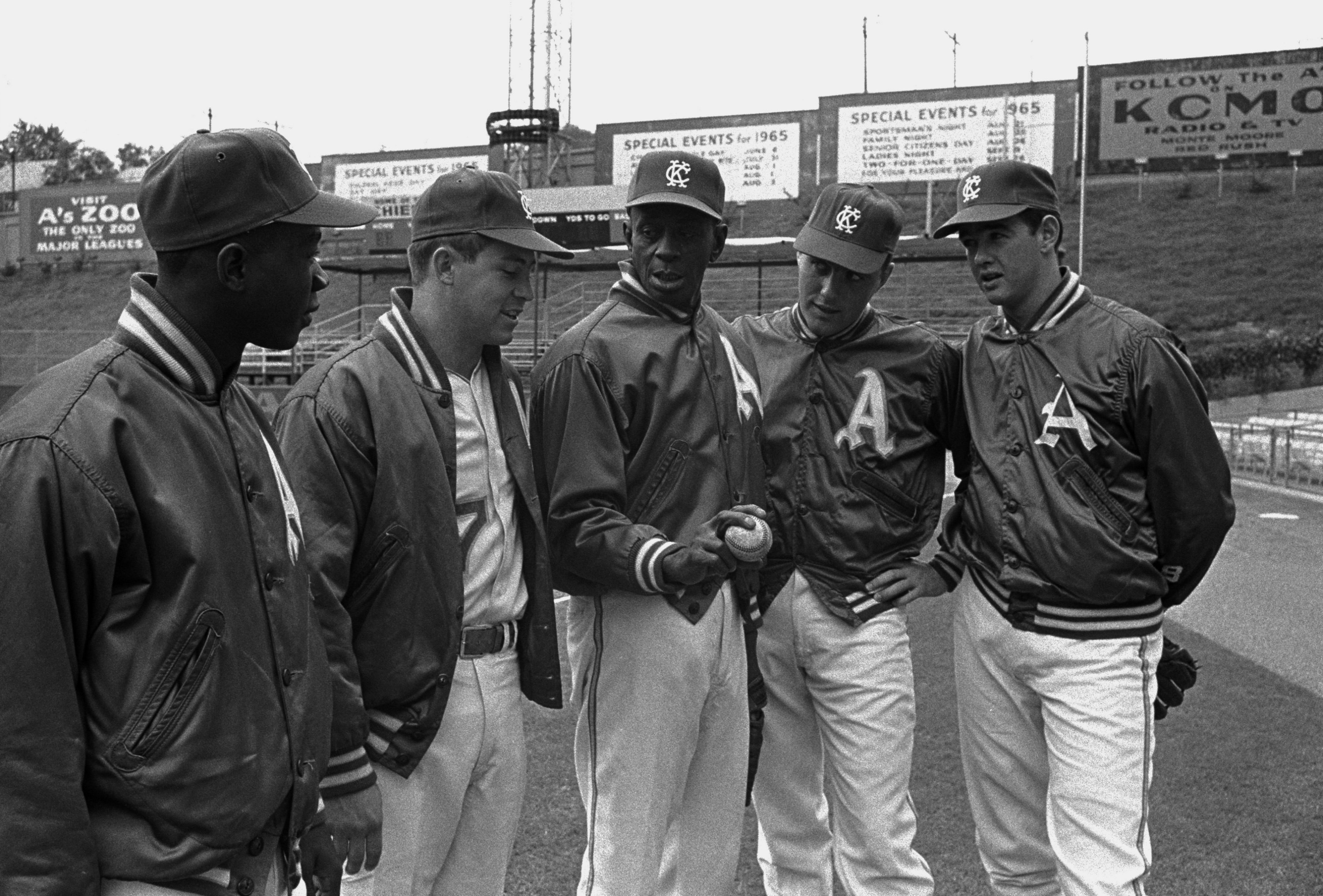 Satchel Paige (C) demonstrates his technique to four Kansas City rookie pitchers, (l-r) John Odom, Jim Hunter, Dick Joyce, and Ron Tompkins, on Sept. 24, 1965. The youngsters are part of the A's youth movement, a development the Athletics management hopes will pay off in a pennant.