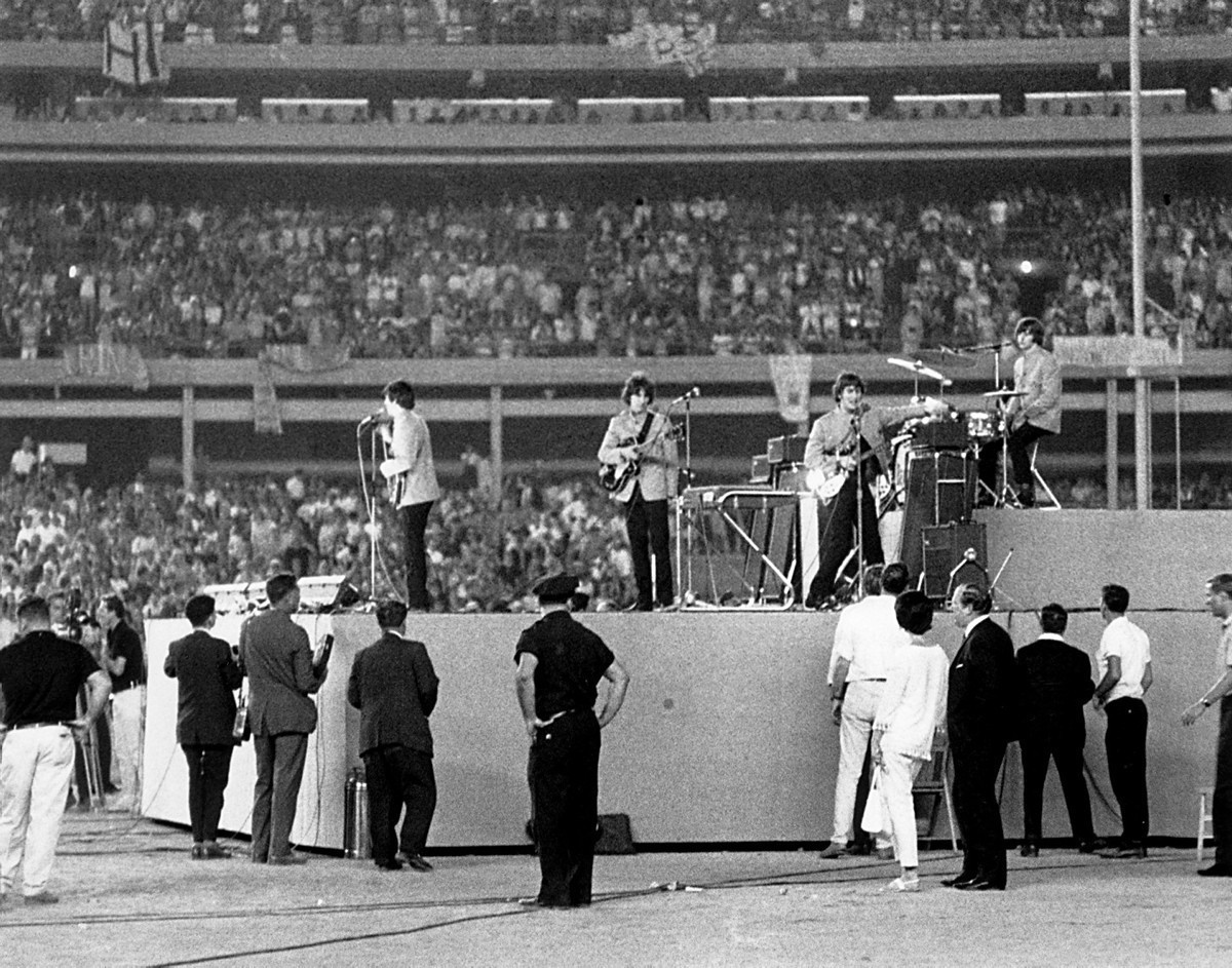 The Beatles take the stage! The iconic rock band is pictured here among thousands of screaming fans at their historic concert at Shea Stadium on Aug. 15, 1965. Nearly 50 years later, member Paul McCartney played the last concert at Shea Stadium with fellow rocker Billy Joel before the stadium finally closed.