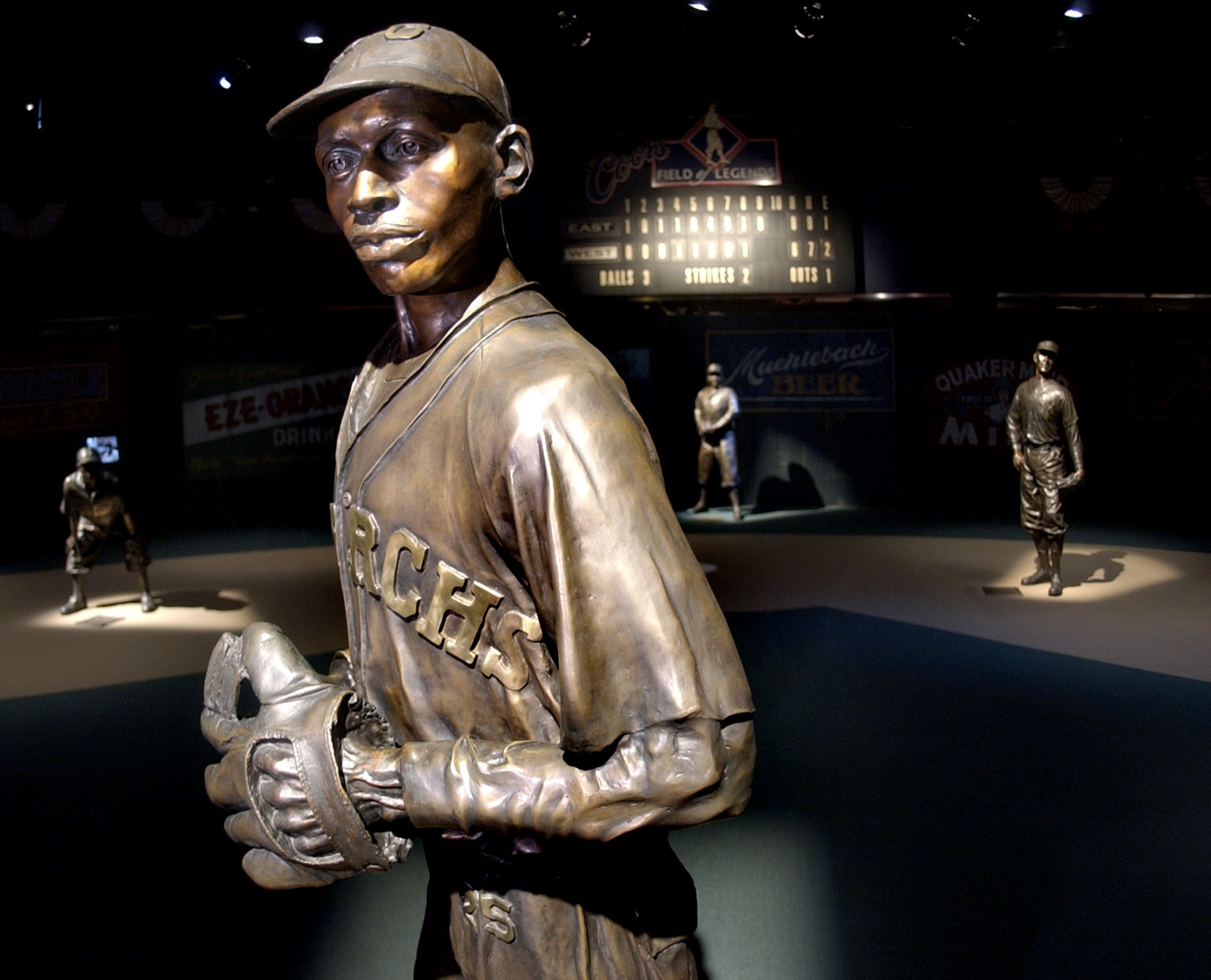Bronze statues of Negro League greats, including pitcher Satchel Paige (front) playing their positions on the Field of Legends are seen at the Negro Leagues Baseball Museum in Kansas City, Mo. on Jan. 27, 2005.