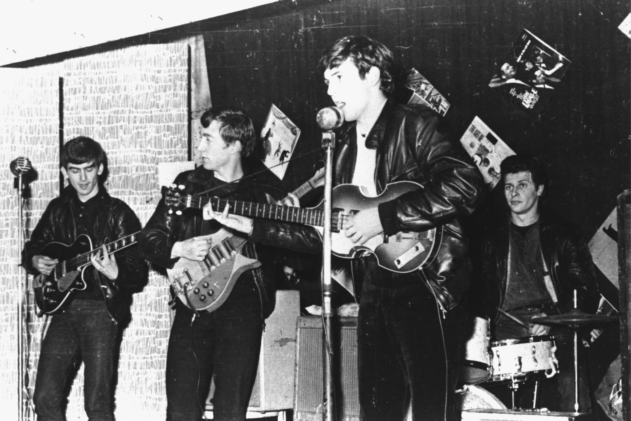 Prior to Ringo Starr joining The Beatles, the group consisted of (l-r) George Harrison, John Lennon, Paul McCartney, and original drummer Pete Best, all here in a club prior to signing their first recording contract in Liverpool, England in 1962. Best was cut from the group and Starr replaced him that same year.