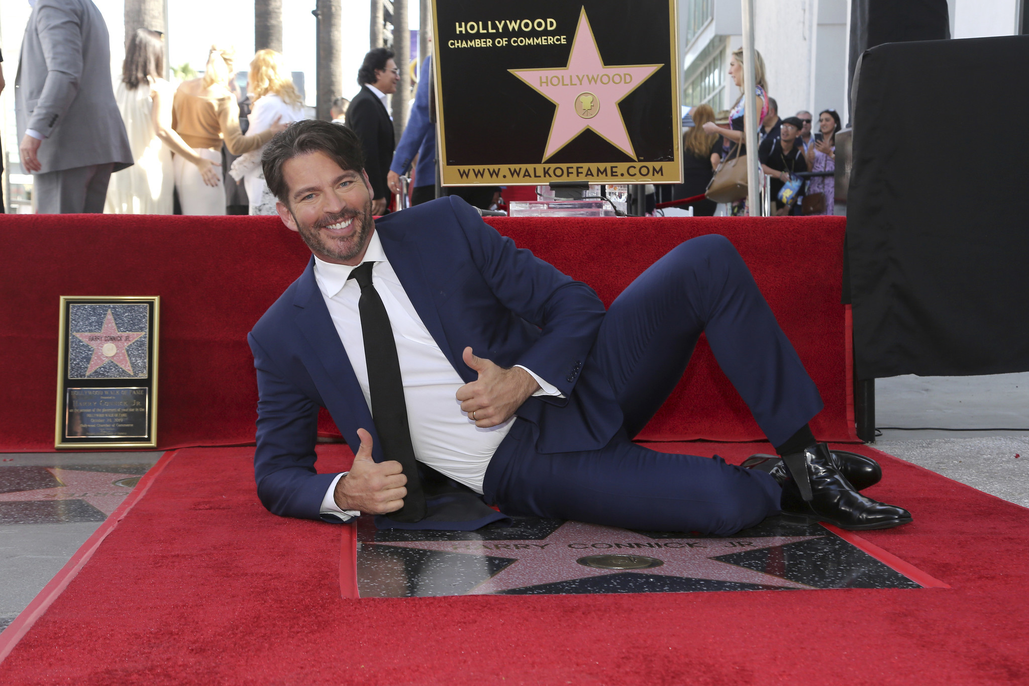 Harry Connick Jr. poses atop his star during a ceremony honoring him with a star on the Hollywood Walk of Fame on Oct. 24, 2019 in Los Angeles, Calif.