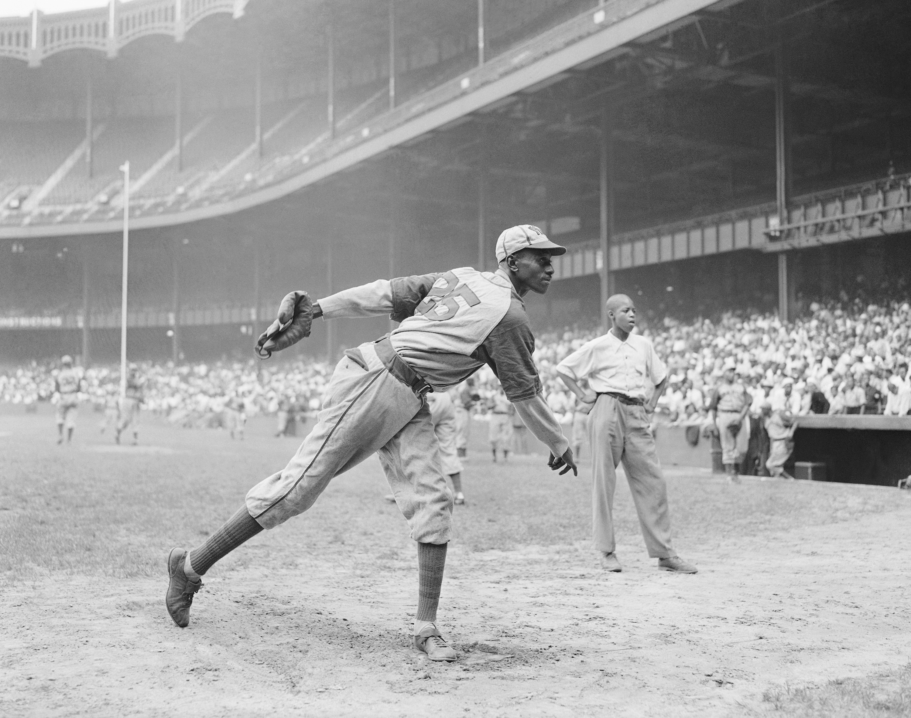 Kansas City Monarchs pitcher Satchel Paige warms up at New York's Yankee Stadium on Aug. 2, 1942, for a Negro League game between the Monarchs and the New York Cuban Stars.