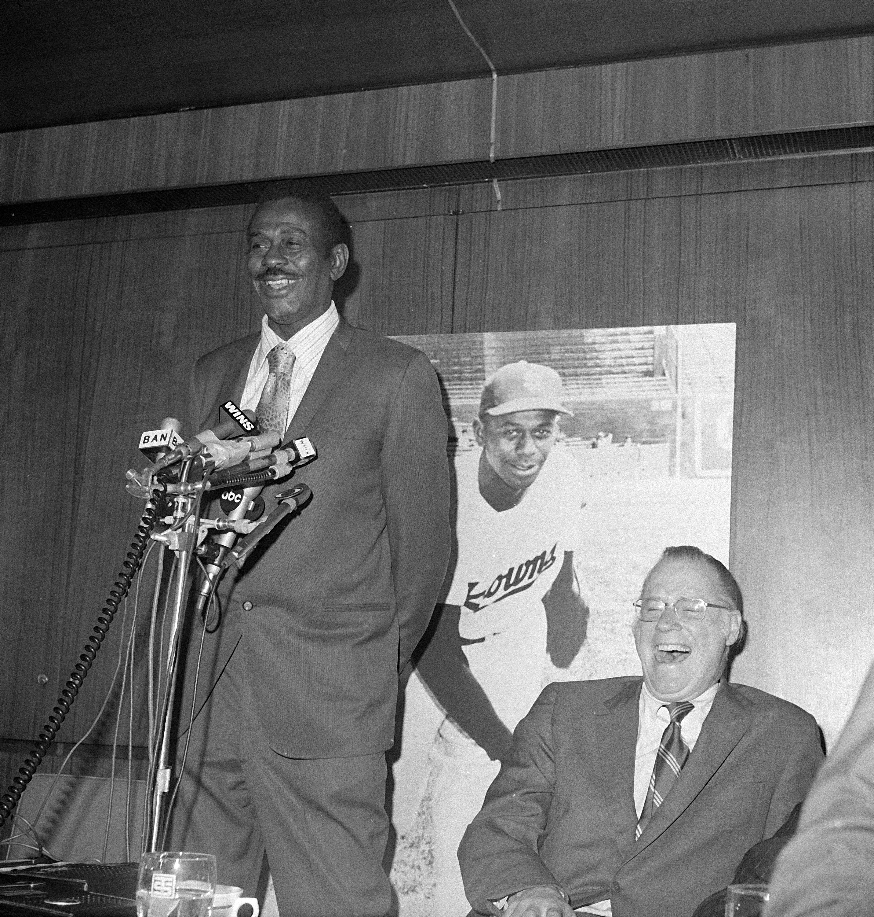Satchel Paige answers questions from the media in New York on Feb. 9, 1971, after being voted into the Baseball's Hall of Fame in a special category designed to honor the outstanding stars of the Negro Leagues. Seated is baseball commissioner Bowie Kuhn, and, in the background, is a photo of Paige in his playing years with the St. Louis Browns.
