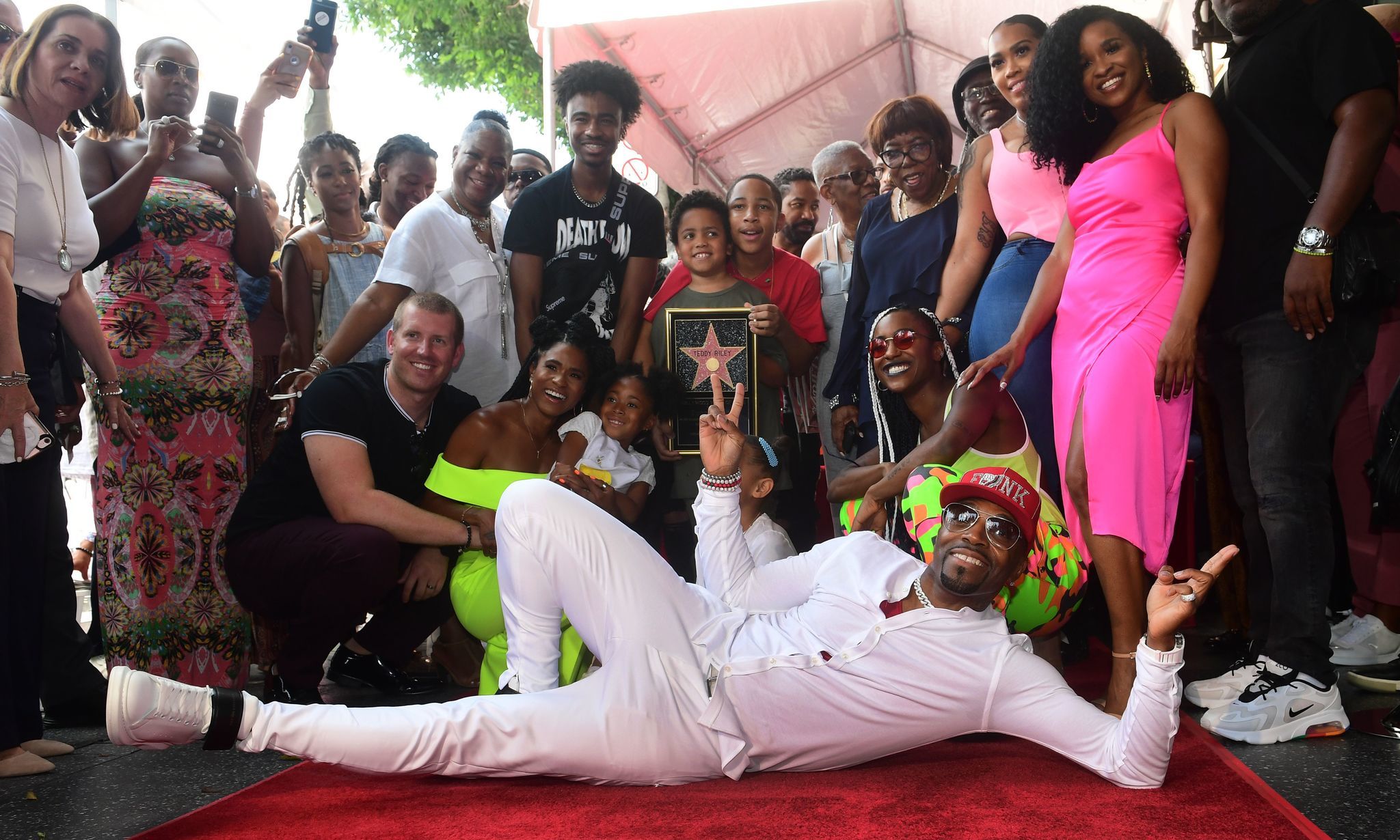 Recording artist and music producer Teddy Riley (front center) poses with his family on his just-unveiled Walk of Fame Star during a ceremony in Hollywood, Calif. on Aug. 16, 2019, where Riley was the recipient of the 2,670th Star in the recording category.