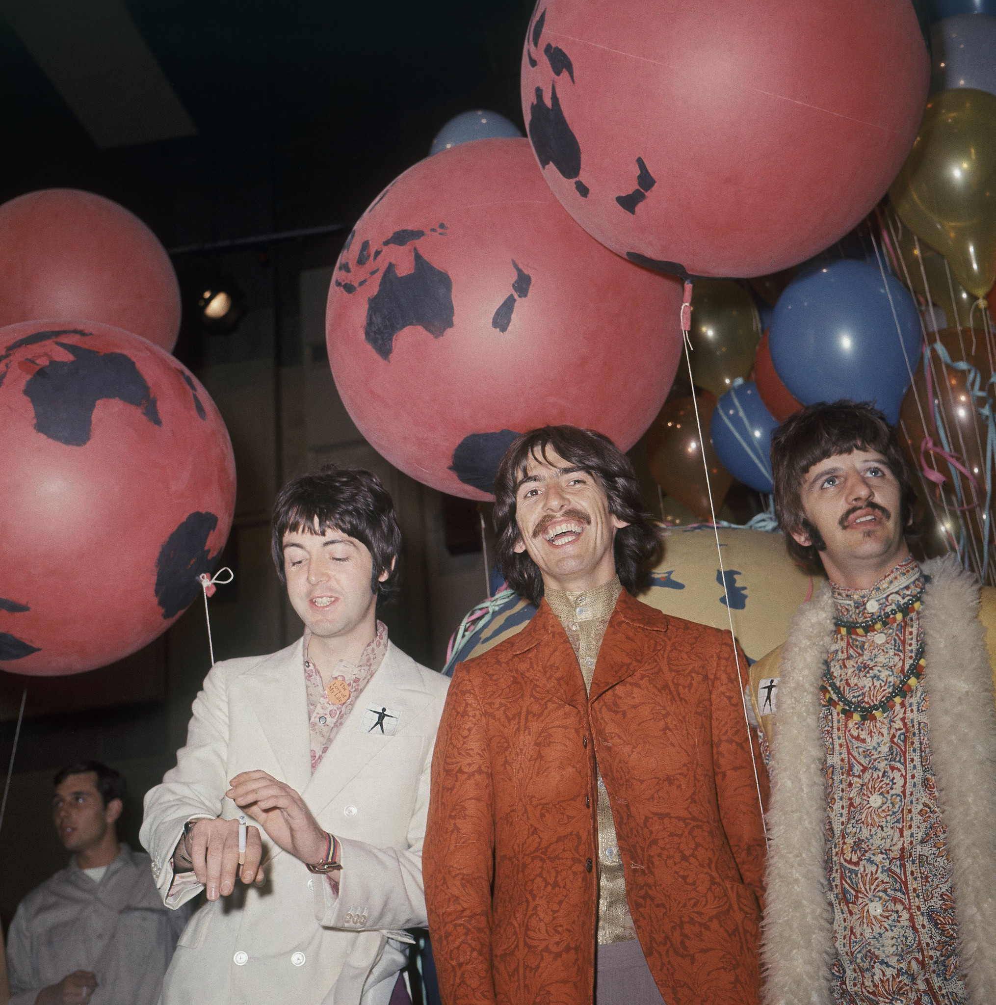 (l-r) Paul McCartney, George Harrison, and Ringo Starr are seen backstage during a break in rehearsal for the live broadcast of their new song 