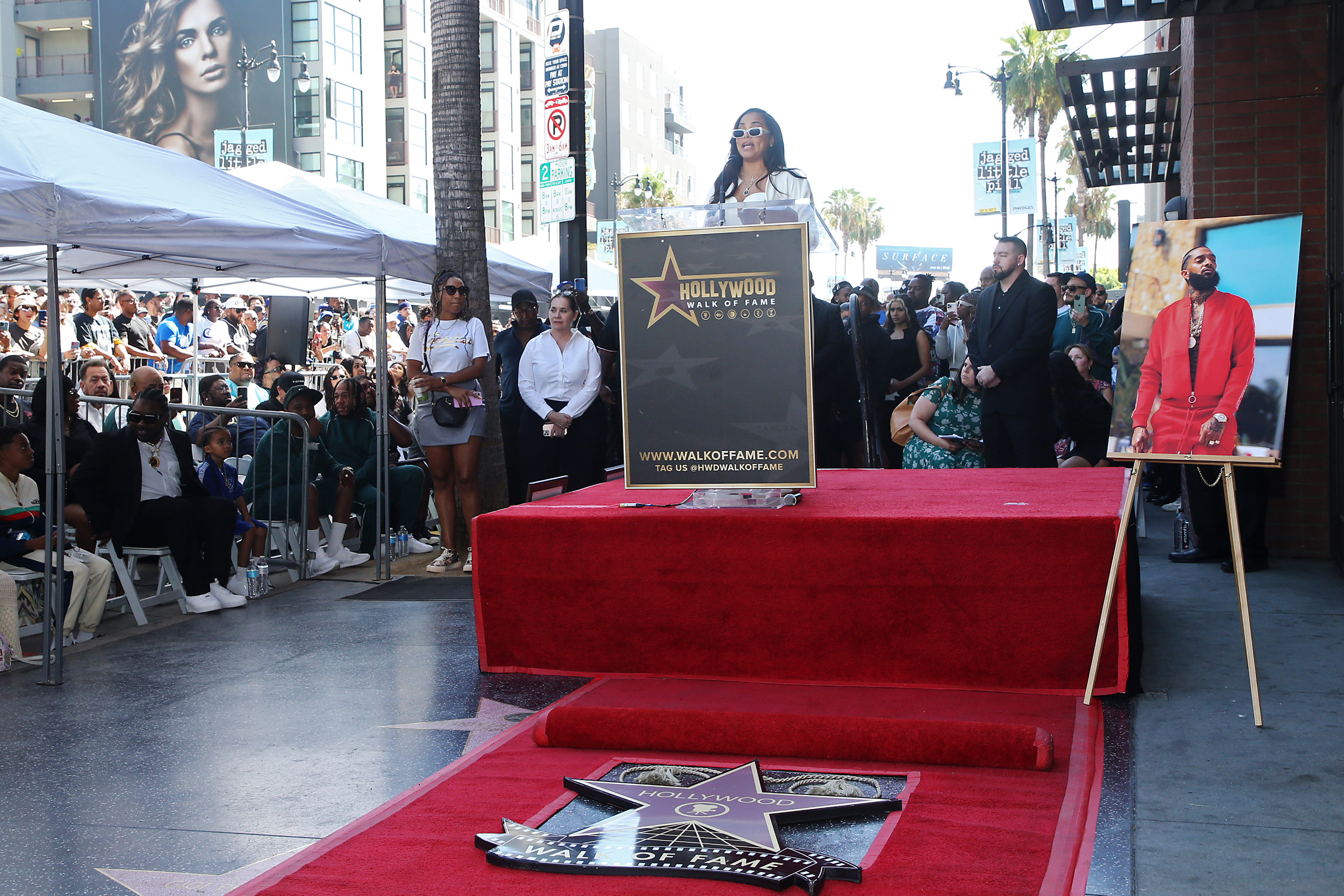 Lauren London speaks onstage as Nipsey Hussle is posthumously honored with a star on The Hollywood Walk of Fame on Aug. 15, 2022, in Los Angeles, Calif.
