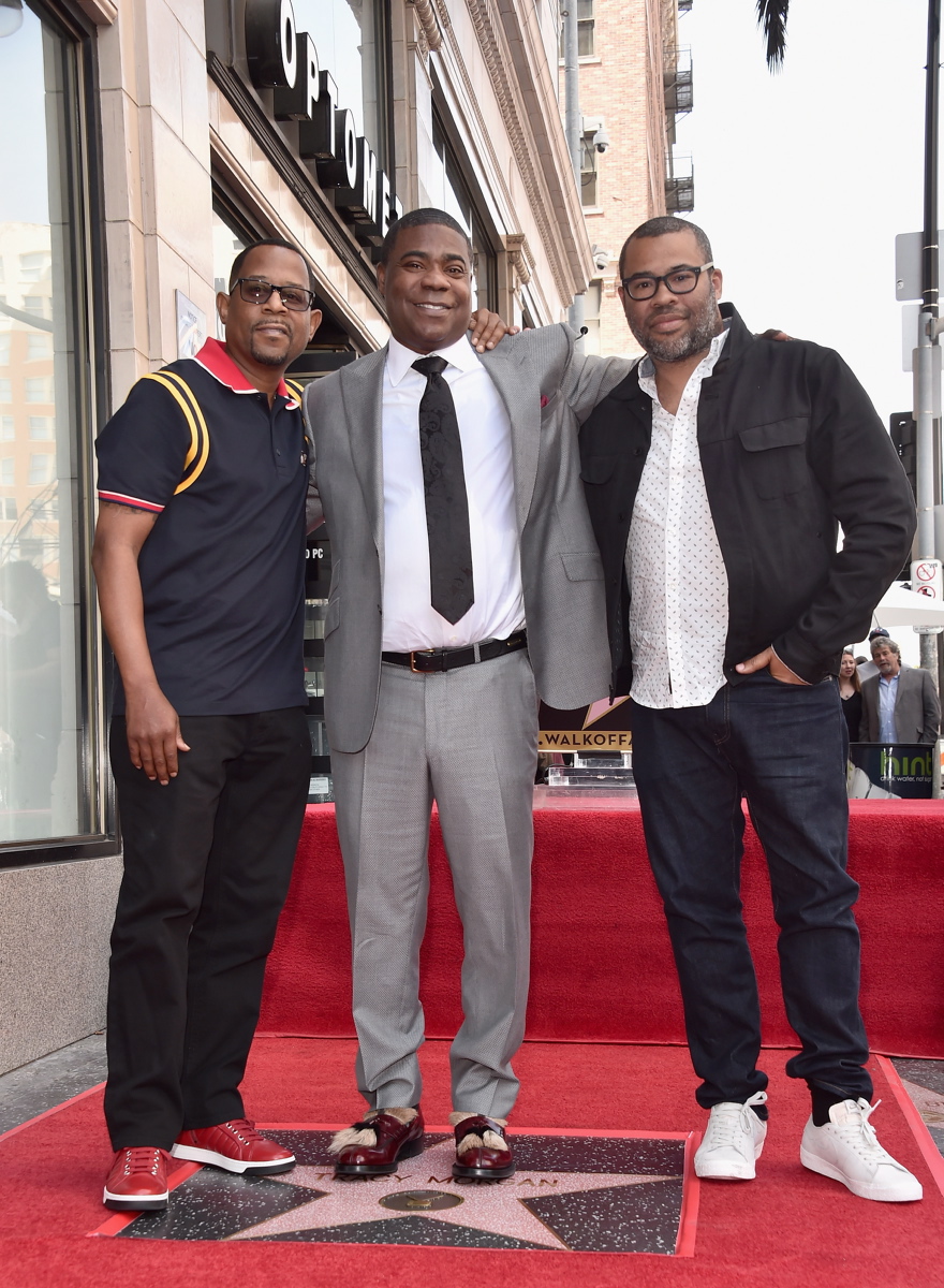 In addition to wife Megan, daughter Maven and son Tracy Jr., Morgan was joined by fellow comedians and actors Martin Lawrence (L), whose show 