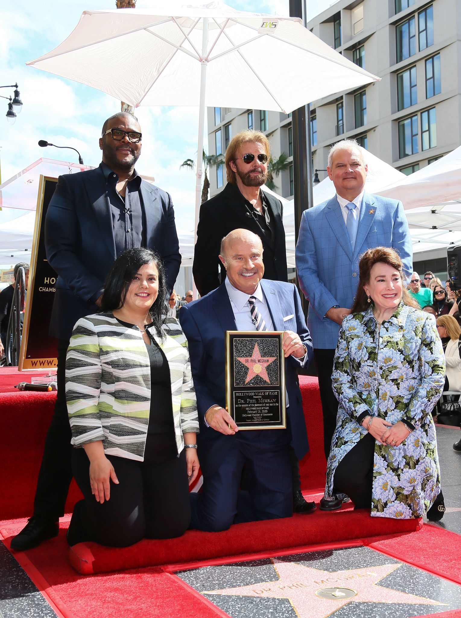 Tyler Perry, top left; Dr. Phil McGraw, bottom center; Ronnie Dunn, top center; and others attend a ceremony honoring lauded TV personality Dr. Phil with a star on the Hollywood Walk of Fame on Feb. 21, 2020, in Los Angeles, Calif. Dr. Phil celebrated the 3,000th episode of his eponymous show on Sept. 24, 2019, after 17 seasons and almost 20,000 guests.