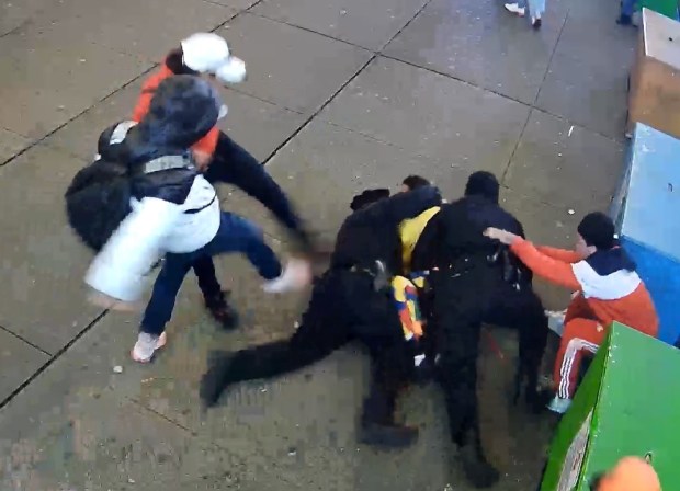 Video surveillance footage from the Times Square melee between a group of migrants and NYPD officers.