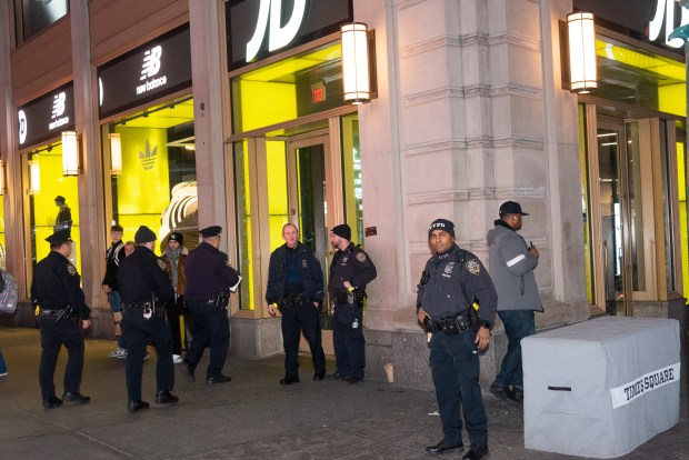 Police respond after a woman was shot inside the JD Sports store on Broadway and 41st Street in Times Square on Thursday, Feb. 8, 2024. (Gardiner Anderson for New York Daily News)