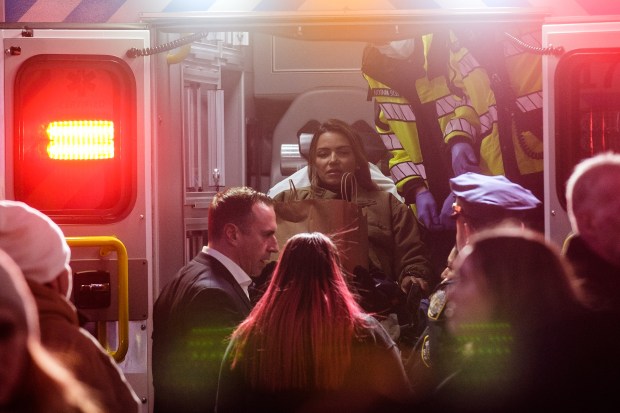 Medics remove an injured woman after a shooting inside the JD Sports store on Broadway and 41st Street in Times Square, Manhattan, New York City on Thursday, Feb. 8, 2024. (Gardiner Anderson for New York Daily News)
