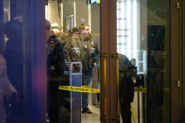 Police investigate after a woman was shot inside the JD Sports store on Broadway and 41st Street in Times Square on Thursday, Feb. 8, 2024. (Gardiner Anderson for New York Daily News)