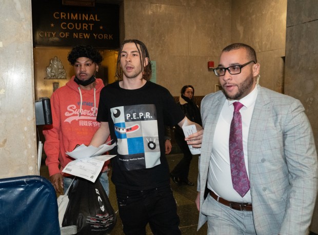 Declyn Lapuper is escorted by his personal security out of Manhattan Criminal Court after making bail for a gun possession charge Friday, Feb. 9, 2024 in Manhattan, New York. (Barry Williams for New Daily News)