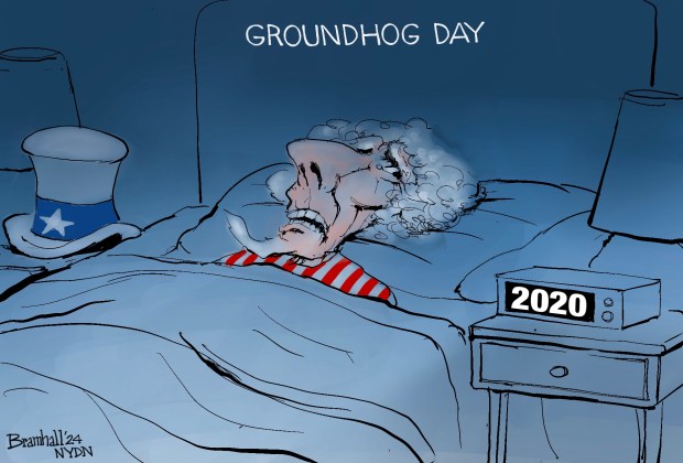 Bill Bramhall's editorial cartoon for Friday, Feb. 2, 2024, shows Uncle Sam in bed on Groundhog Day with a clock next to him that reads "2020."