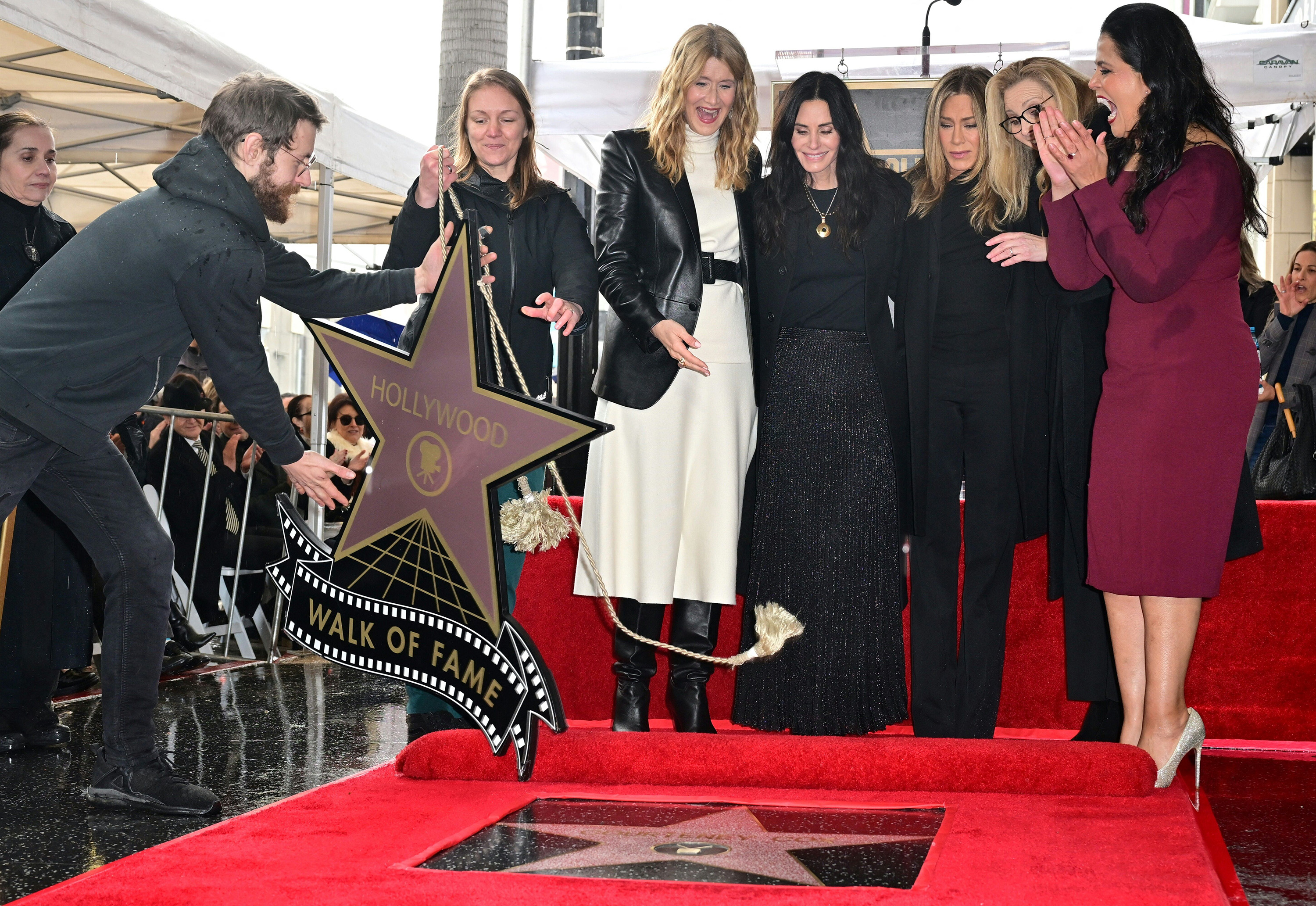(L-R) Laura Dern, Courteney Cox, Jennifer Aniston, Lisa Kudrow, and Hollywood Chamber of Commerce Chair Lupita Sanchez Cornejo react as Cox's Hollywood Walk of Fame star in unveiled during a ceremony on Feb. 27, 2023, in Hollywood, Calif.