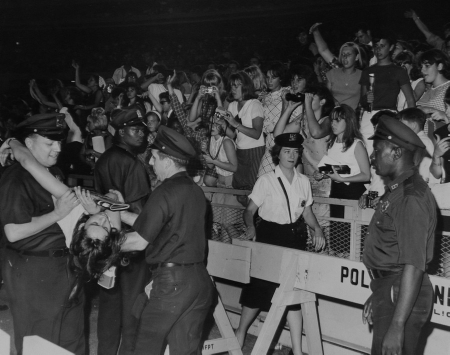 One of the biggest stories out of Shea Stadium that night was the hysteria of the audience. Among the delirious teenagers at the sold-out concert was this fan, who had to be carried off after fainting on Aug. 15, 1965.