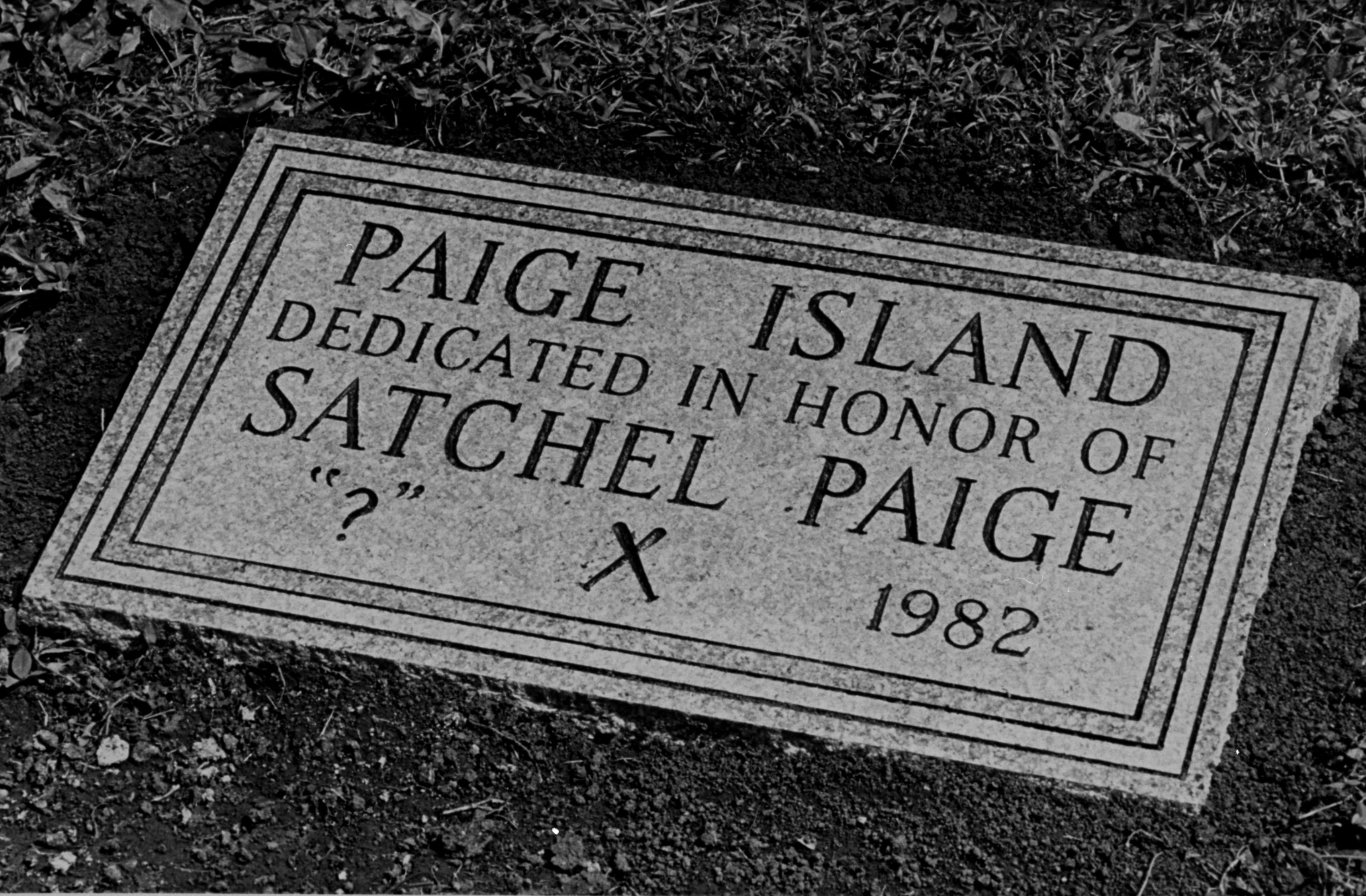 A stone marking the site of the grave of Hall of Famer Satchel Paige sits on the edge of a donated piece of land where Paige was laid to rest on June 12, 1982. Paige and his wife will be the only people buried on the land, which is surrounded on all sides by roads. A question mark was used instead of a date for his birth because, at the time, the actual date of his birth is unknown. Paige's birth certificate states that he was born on July 7, 1906.