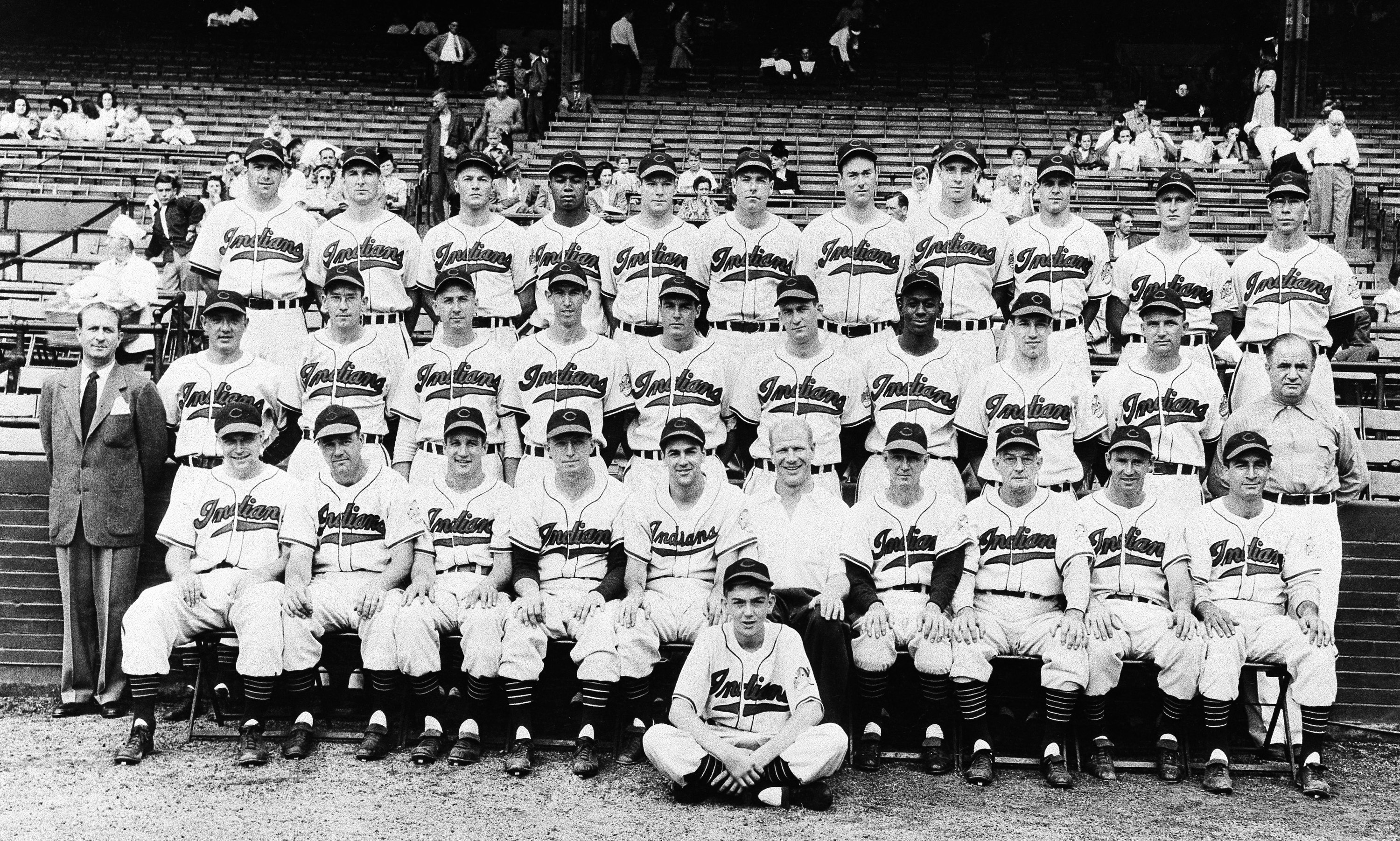 The 1948 Cleveland Indians are seen in their most recent team picture at the time on Oct. 3, 1948, in Cleveland: (front row, left to right) Eddie Robinson, first base; Ken Keltner, third base; Al Rosen, third base; Mel Harder, Coach; Manager Lou Boudreau, shortstop; President Bill Veeck; Muddy Ruel, Coach; Bill McKechnie, Coach; Joe Gordon, second base; and Johnny Beradino, traveling secretary; Sam Zoldak, Ed Kleiman, Steve Gromek, Russ Christopher, Gene Bearden, Bob Lemon, Satchel Paige, Bob Feller, and Bob Muncriff (all pitchers); Lefty Weisman, trainer; (top row) Walt Judnich, Allie Clark, Hal Peck, Larry Doby, Hank Edwards, Dale Mitchell, Bob Kennedy, all outfielders; Jim Hegan, catcher; Ray Boone, shortstop and catcher; Joe Tipton, catcher; and Thurman Tucker, outfielder.
