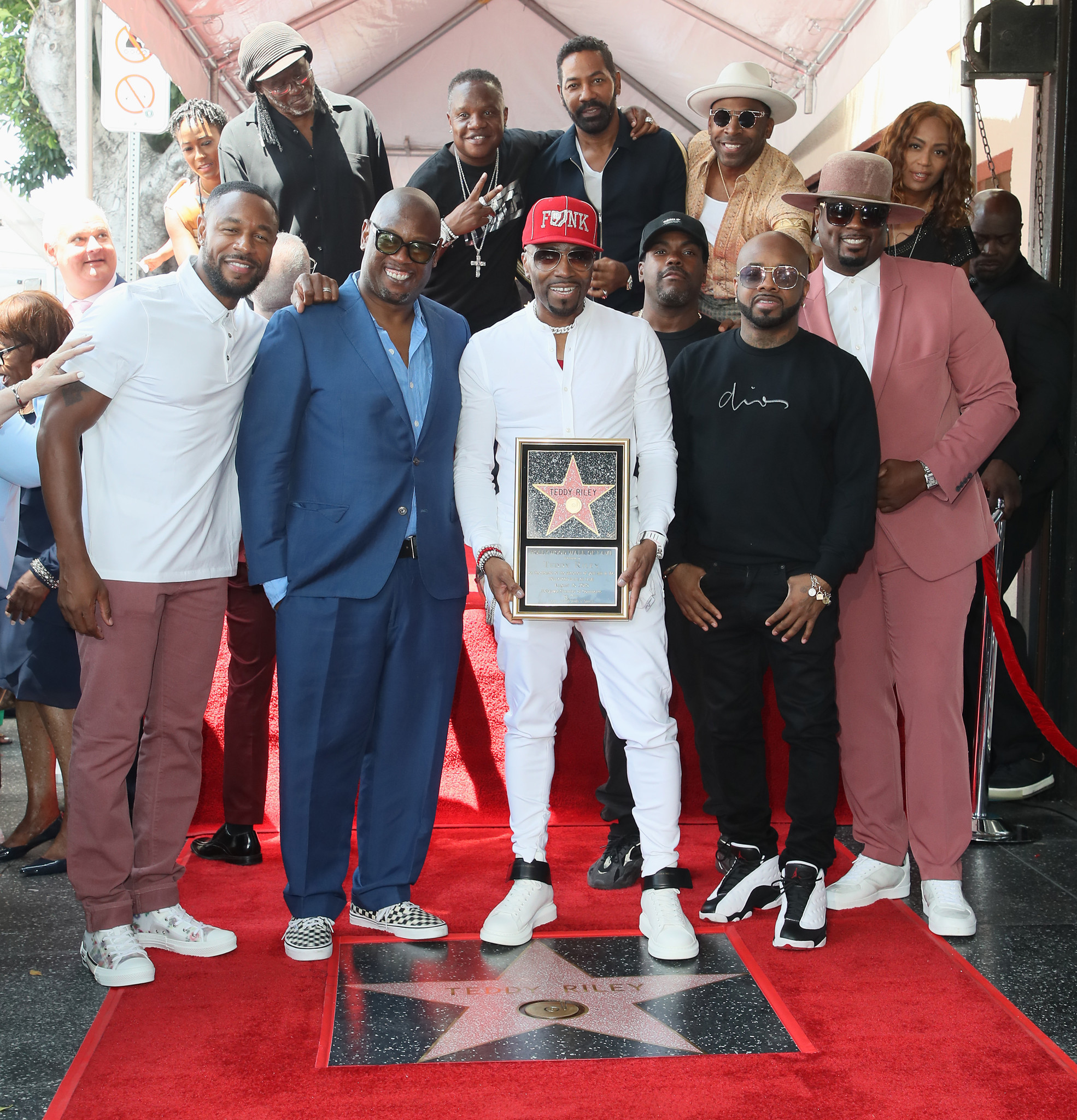 Tank, left, Andre Harrell, Teddy Riley, Jermaine Dupri and friends attend as Riley is honored with a pink star on the Hollywood Walk of Fame on Aug. 16, 2019.